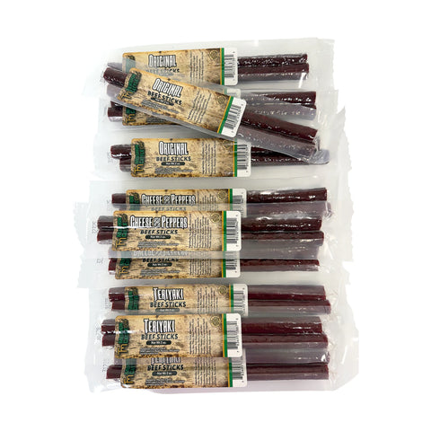 Multiple packages of beef sticks with a mixture of different flavors like Original, Teriyaki and Cheese and Peppers on a white background