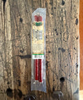 Packaged beef sticks on a wooden surface 