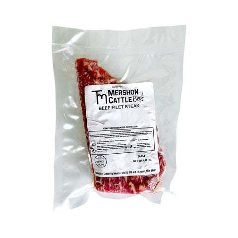 Packaged beef filet steak with Mershon Cattle label on a white background