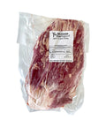 Packaged beef flank steak with a label on a white background