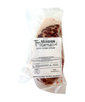 Vacuum sealed package of a Mershon Cattle frozen beef strip steak on a white background