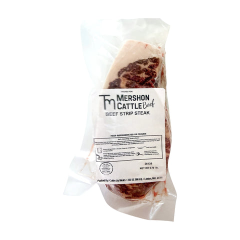 Vacuum sealed package of a Mershon Cattle frozen beef strip steak on a white background