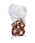 Packaged meat products in a clear plastic bag on a white background
