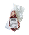 Packaged beef ribeye steak with Mershon Cattle label on a white background