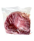 Raw meat in a clear plastic bag on a white background