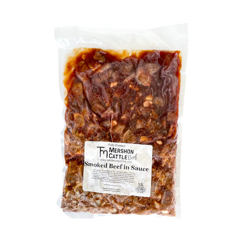 Package of smoked beef in sauce with Mershon Cattle label on a white background